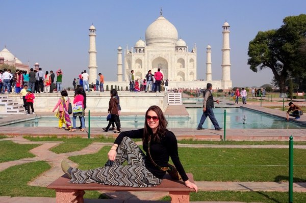 A volunteer sitting in the gardens in front of the Taj Mahal