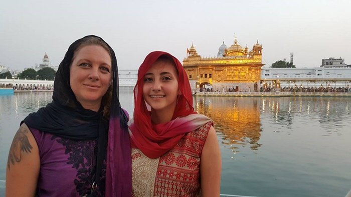 Two volunteers with their heads covered at the Golden Temple in Amritsar