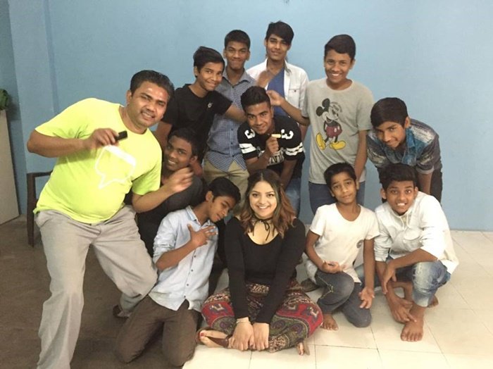 Marcia with a group of boys and a staff member at her project in Delhi