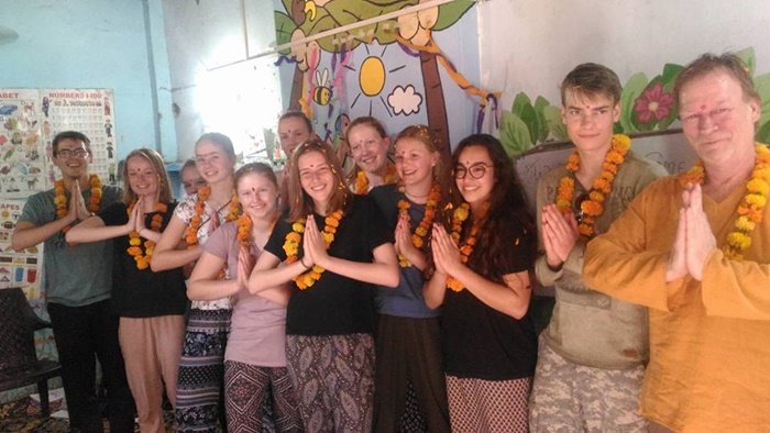 The Wolfert Dalton group wearing marigold garlands at a school in Delhi