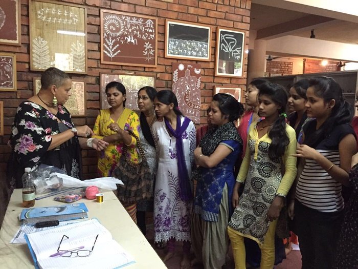 Volunteers with women at a center in Delhi
