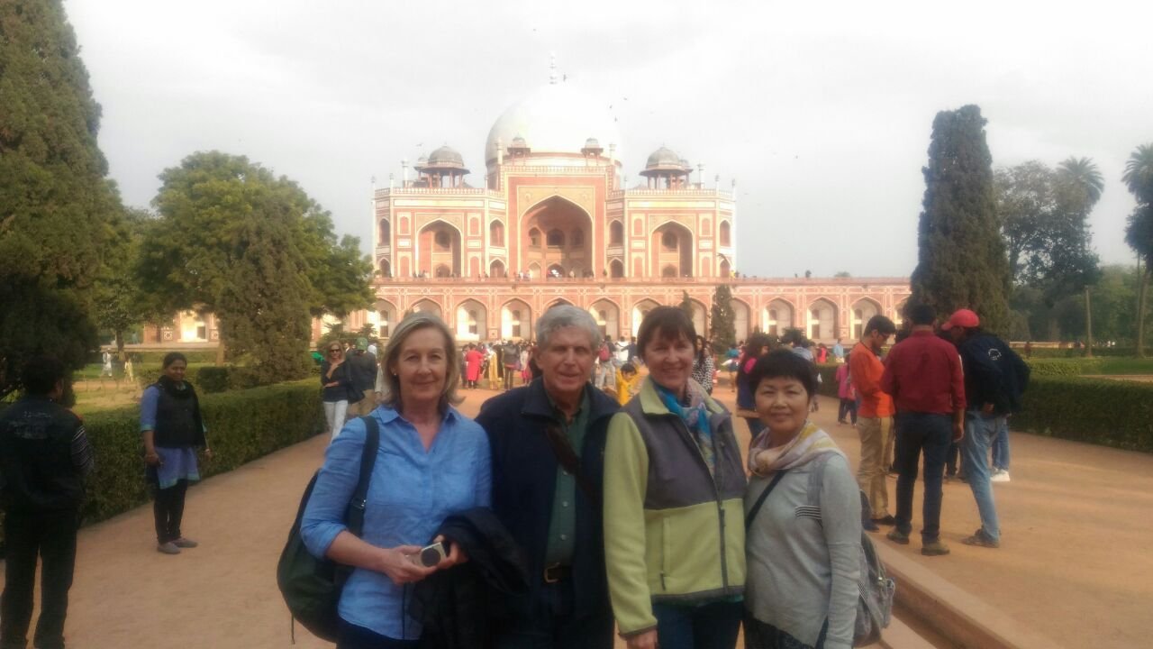 Four volunteers in front of Humayun’s Tomb in Delhi