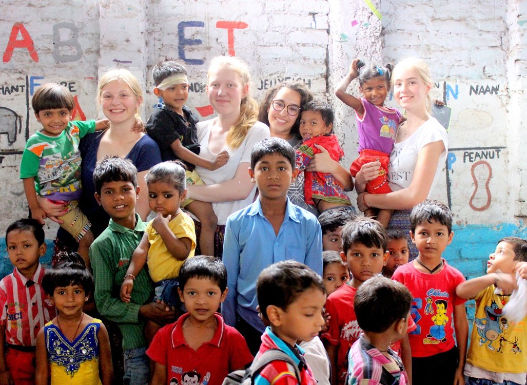 Volunteers with children at a children’s center