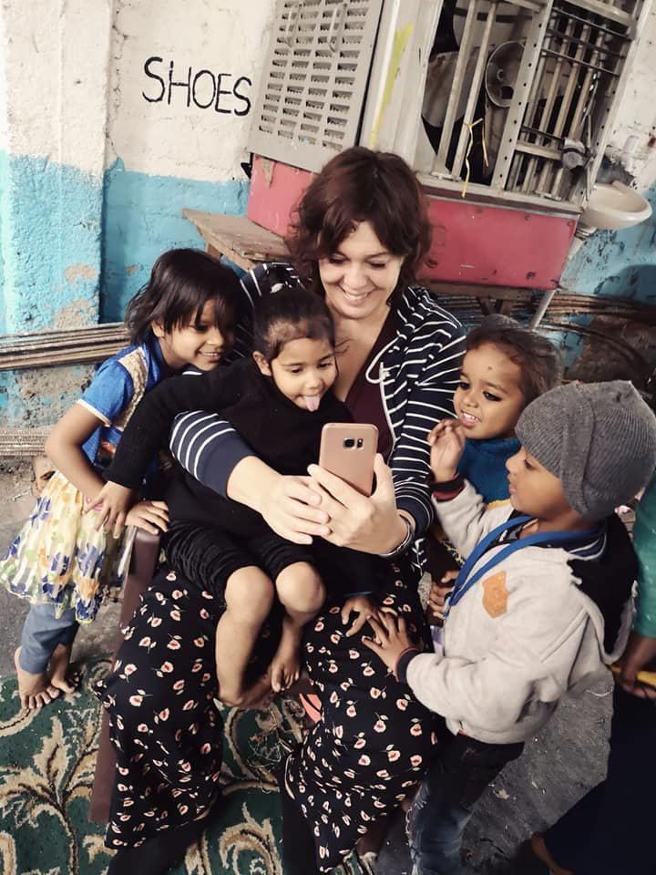 A volunteer running an activity with children