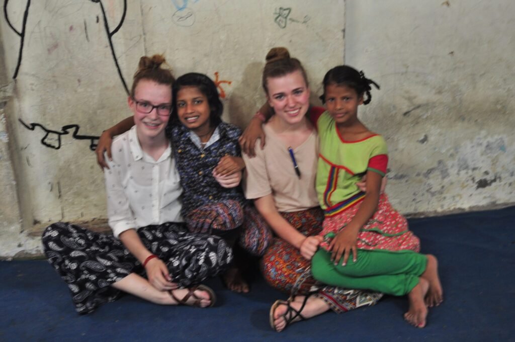 A volunteer with children at a childcare project in Delhi