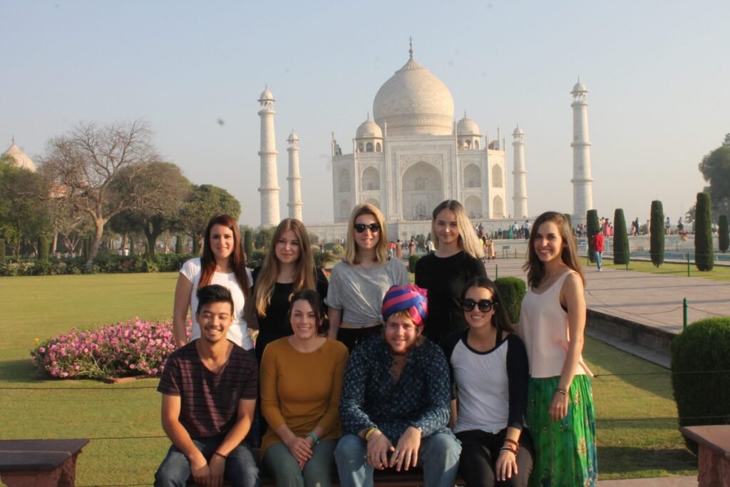 A group of volunteers in front of the Taj Mahal