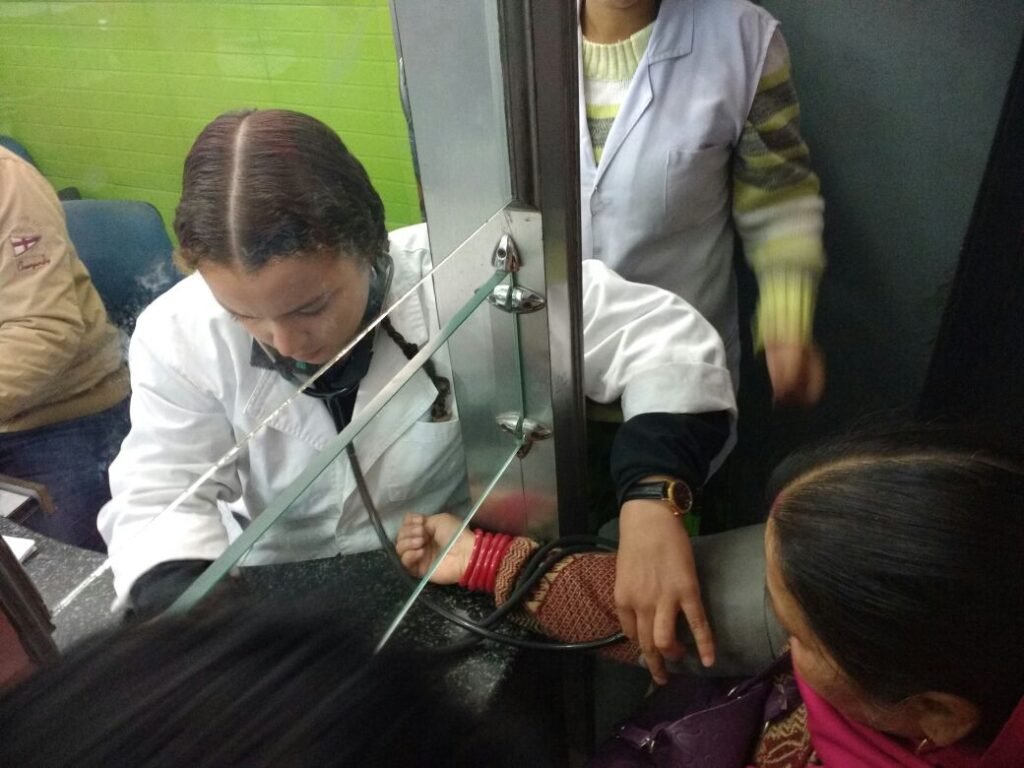 A medical intern checking a patient’s blood pressure