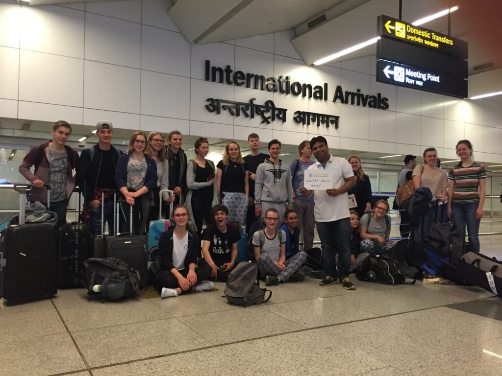 Our coordinator meeting a group of volunteers at Delhi airport arrivals
