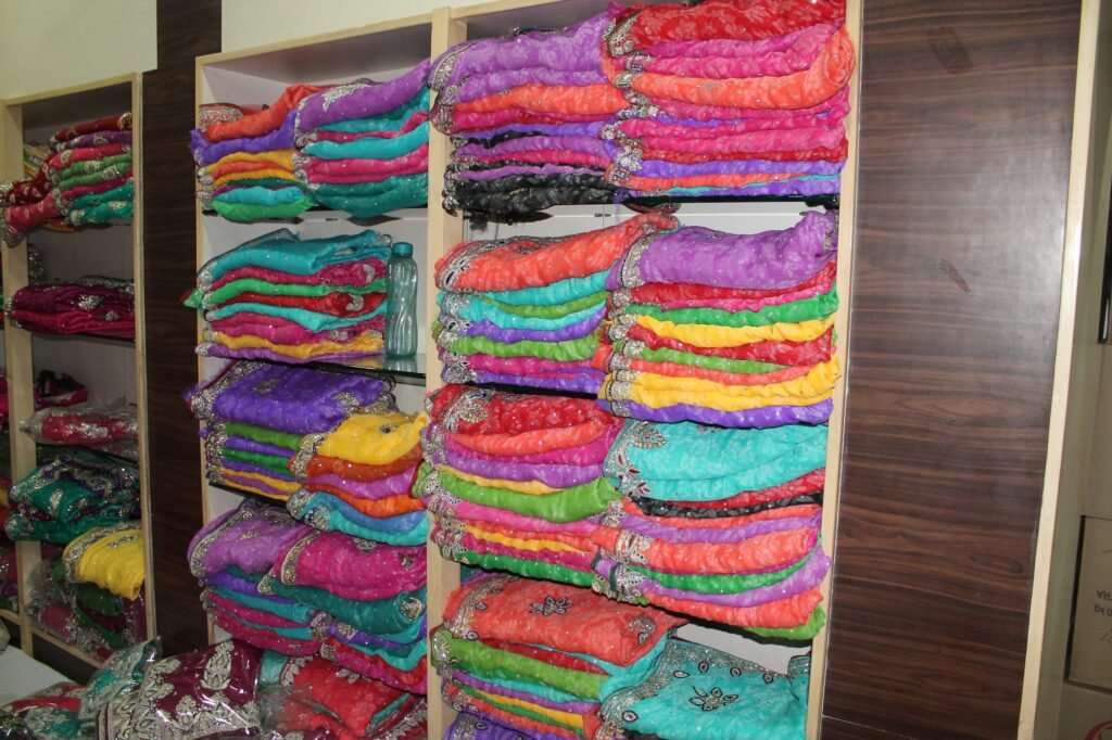 Shelves of colorful fabrics in a textile shop in Jaipur