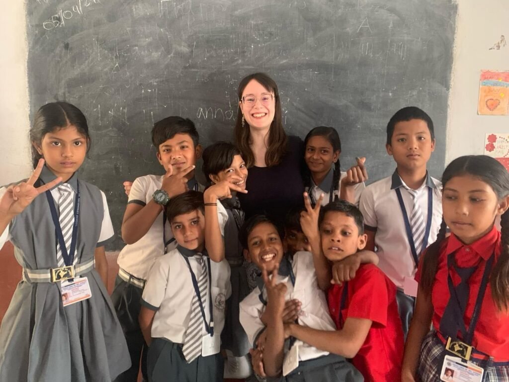 School children with a volunteer at a blackboard in Jaipur