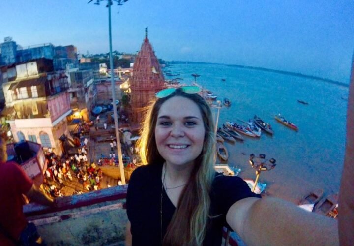 A volunteer above the ghats of Varanasi at dusk
