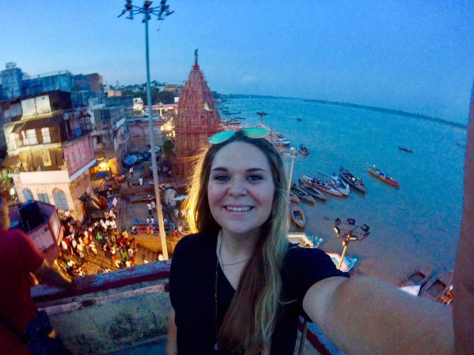 A volunteer above the ghats of Varanasi at dusk