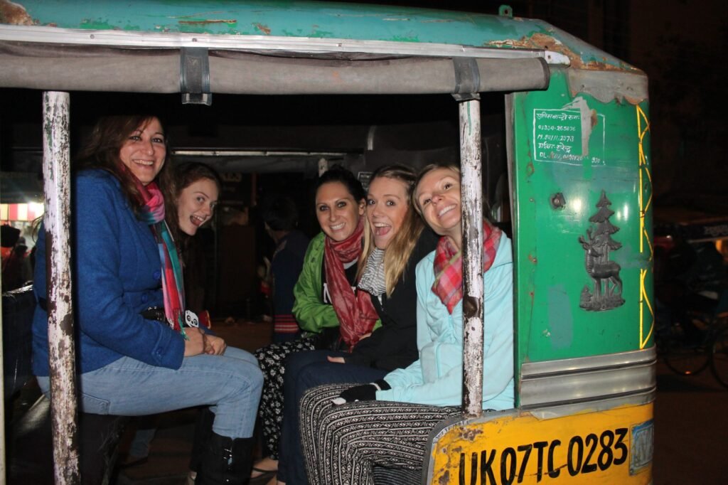Volunteers squeezed into the back of an auto-rickshaw