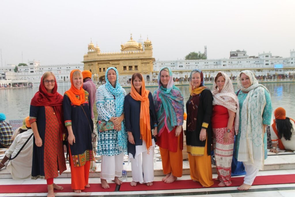 Volunteers in headscarves at the Golden Temple in Amritsar