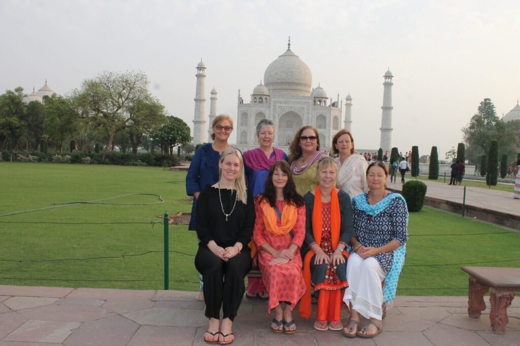 A group of volunteers in front of the Taj Mahal