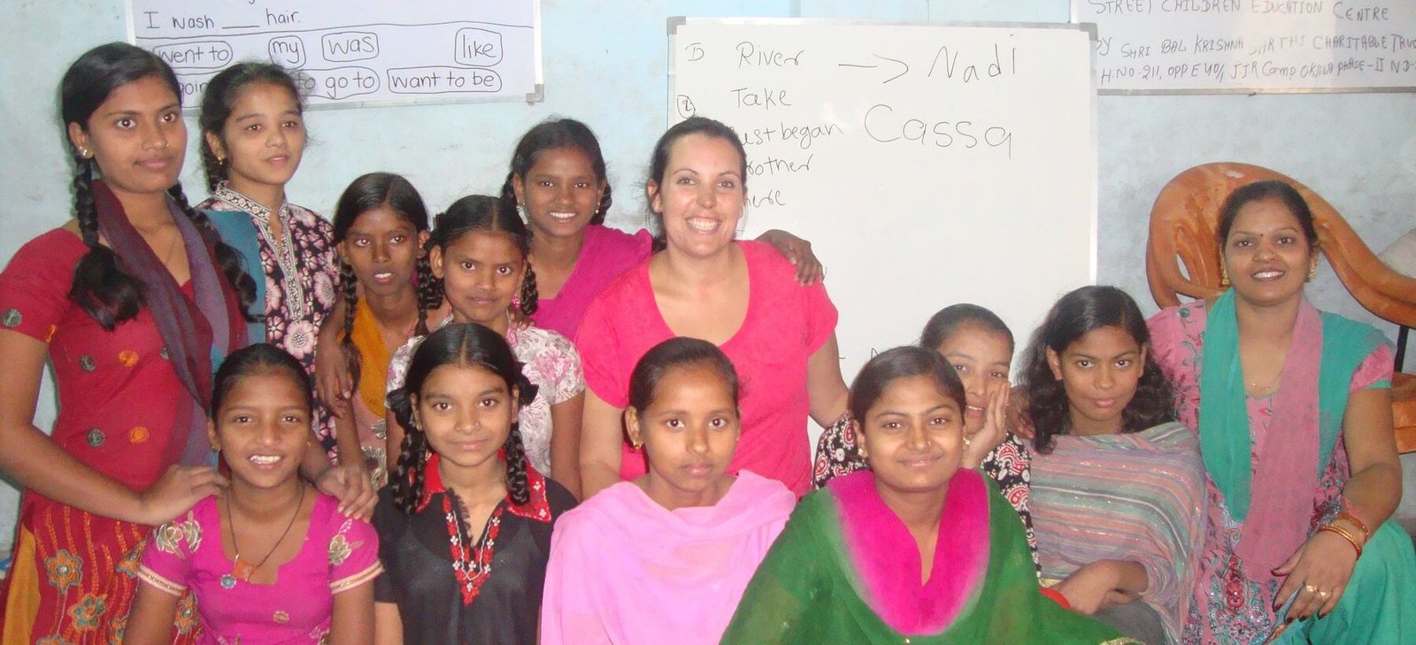 A volunteer with women and girls after an English lesson at a community center in Delhi