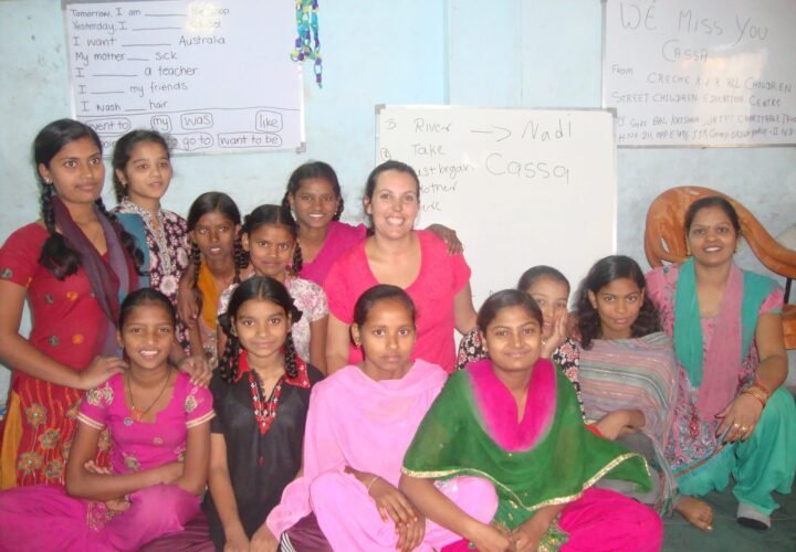A volunteer with women and girls after an English lesson at a community center in Delhi